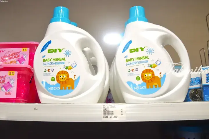 MR DIY Baby Herbal Laundry Detergent bottles on a store shelf with a price tag of RM 11.90.
