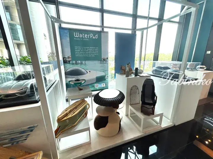 Exhibition display showcasing the WaterPad water harvesting device alongside other innovative sustainable products.