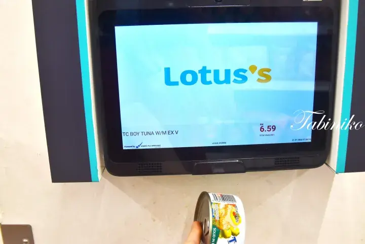 Self-checkout screen at Lotus’s displaying a tuna can price of RM6.59.