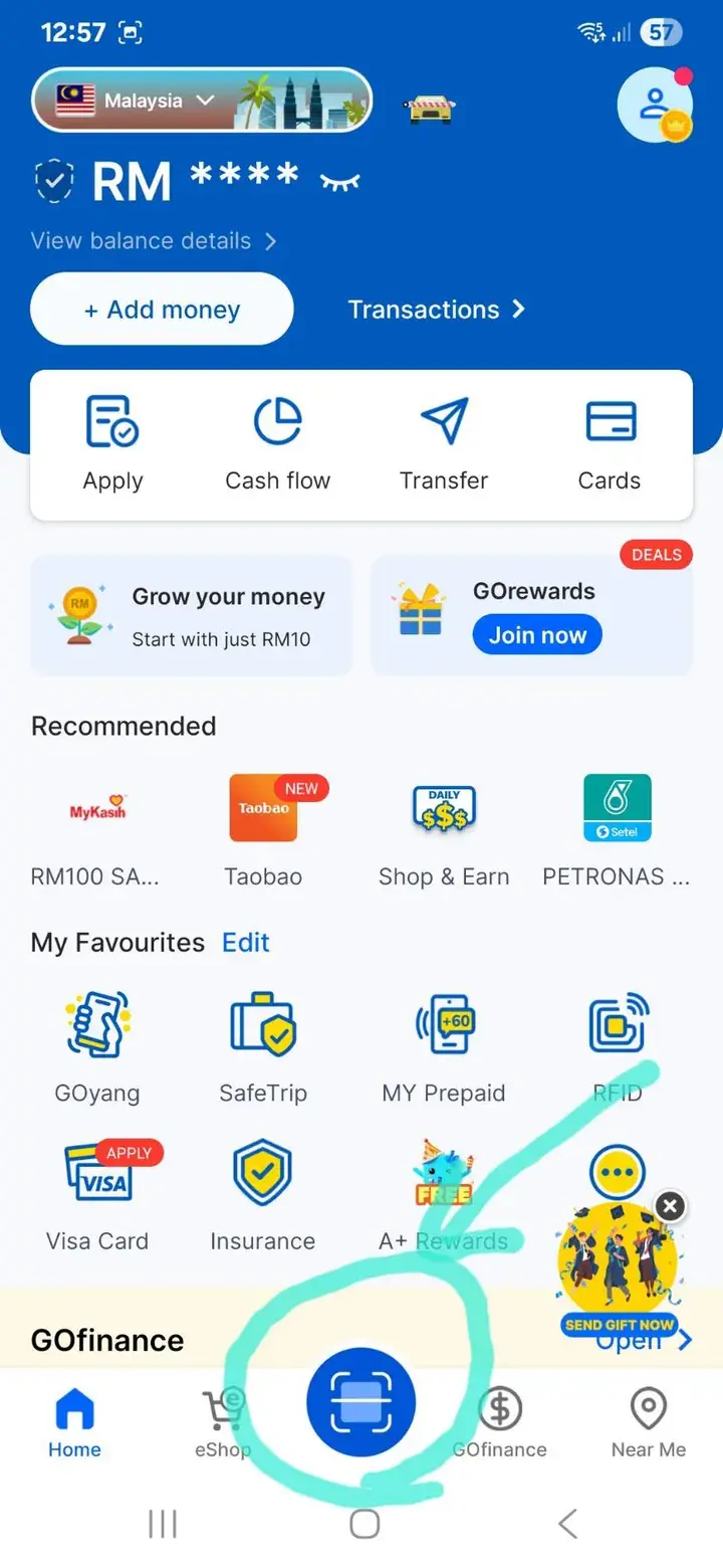Screenshot of a Malaysian digital wallet app showing RM balance, quick actions, and a highlighted scan button at the bottom.