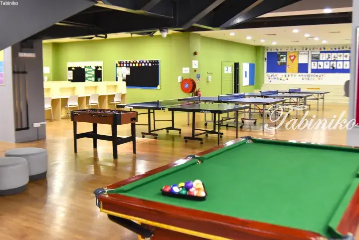Recreational room with pool table, foosball, and ping pong tables at a Malaysia property.