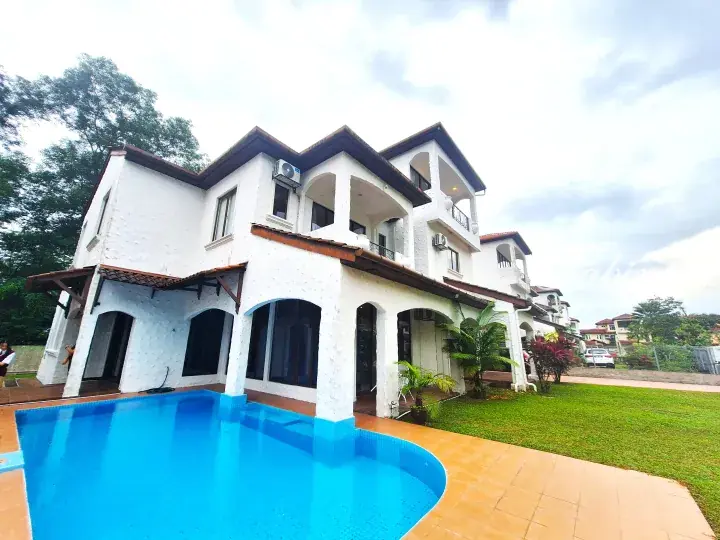 White Mediterranean-style luxury villa with private swimming pool and landscaped garden in Malaysia.