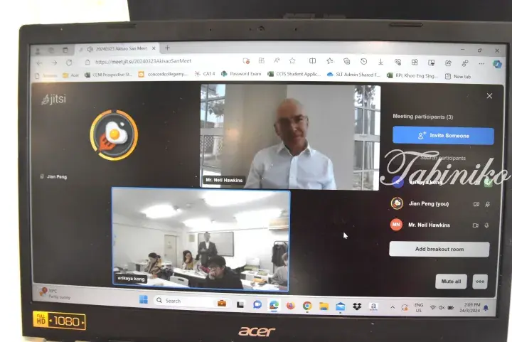 Laptop screen showing a Jitsi video call with Mr. Neil Hawkins and a classroom view, dated March 24, 2024.