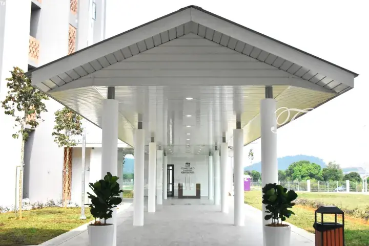Modern entrance canopy with white pillars at Concord College International School in Malaysia.