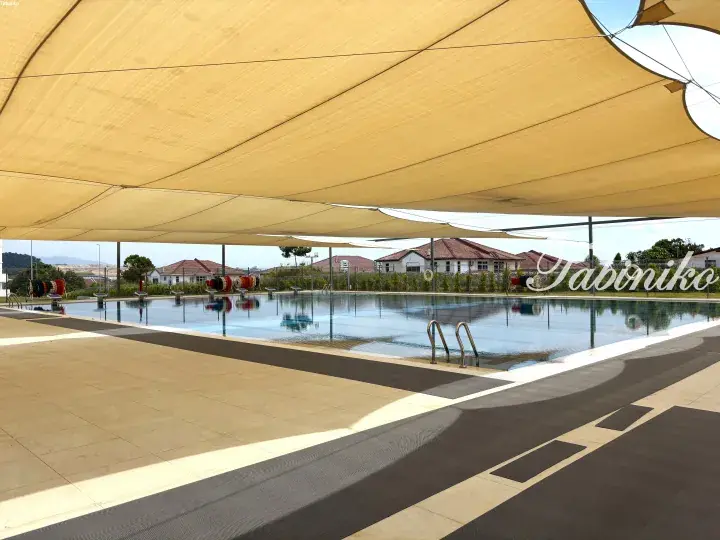 Covered swimming pool with shade sails at a residential property in Malaysia