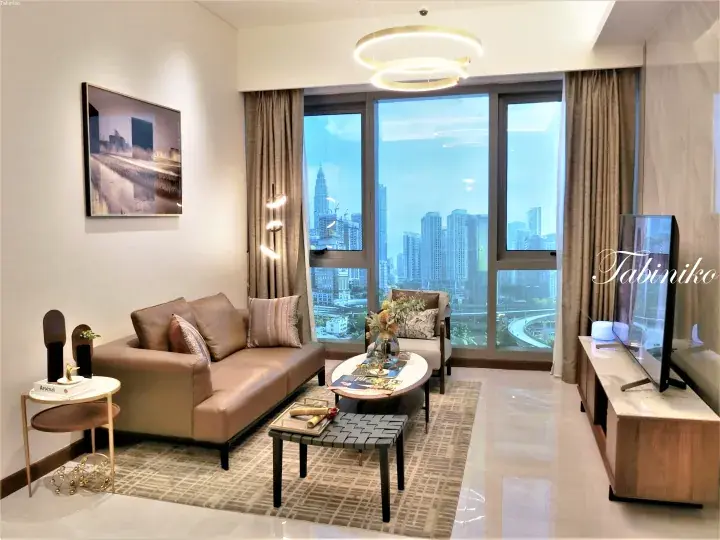 Modern living room with city view featuring Petronas Twin Towers in Kuala Lumpur