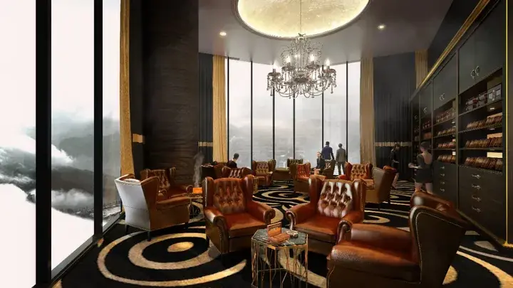 Luxury lounge with leather armchairs, chandelier, and floor-to-ceiling windows overlooking a mountainous landscape.