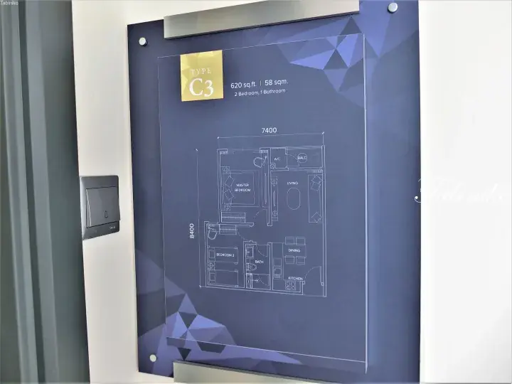 Floor plan display for Type C3 apartment showing 2 bedrooms, living area, and kitchen layout in a showroom.