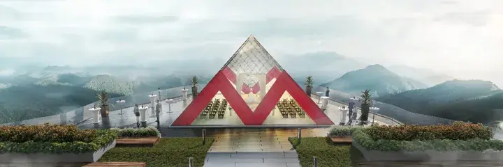 Glass pyramid chapel with red accents on a mountain terrace overlooking misty hills.