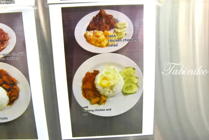 Menu photo showing Set A chicken chop with salad and Set B rendang chicken with egg and cucumber.