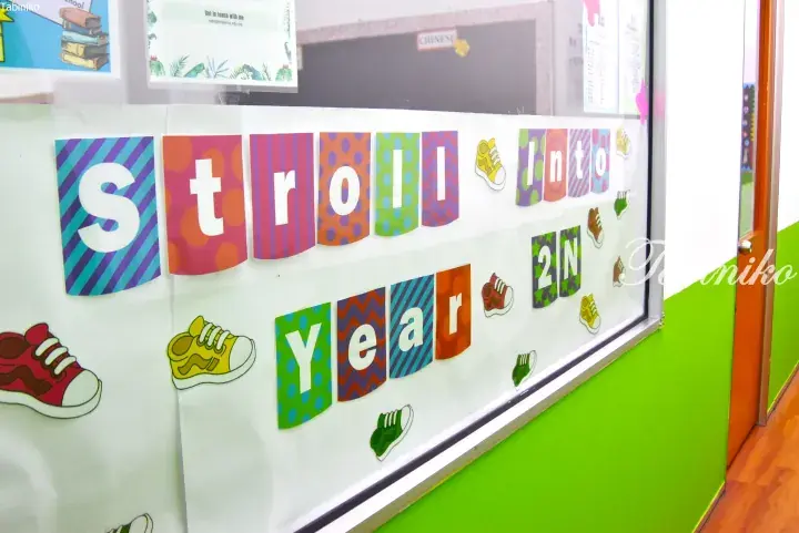 Colorful classroom bulletin board with &ldquo;Stroll Into Year 2N&rdquo; lettering and shoe decorations.