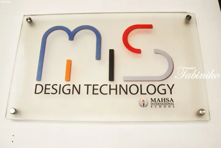 Sign for MIS Design Technology at Mahsa International School featuring colorful letters.