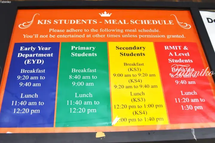 KIS students meal schedule poster showing breakfast and lunch times for Early Year, Primary, Secondary, and RMIT departments.