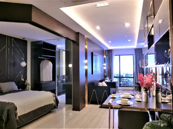 Modern luxury apartment interior featuring a bedroom, walk-in closet, and dining area with city views.