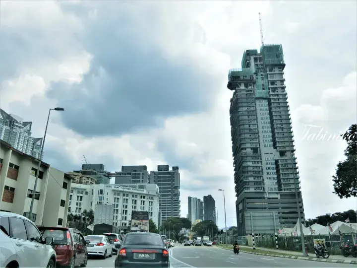 View of Jalan Tun Razak in Kuala Lumpur showing Gleneagles Hospital and a high-rise building under construction.