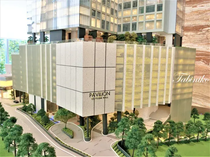 Architectural model of Pavilion Ceylon Hill featuring a modern podium with perforated screens and landscaped surroundings.