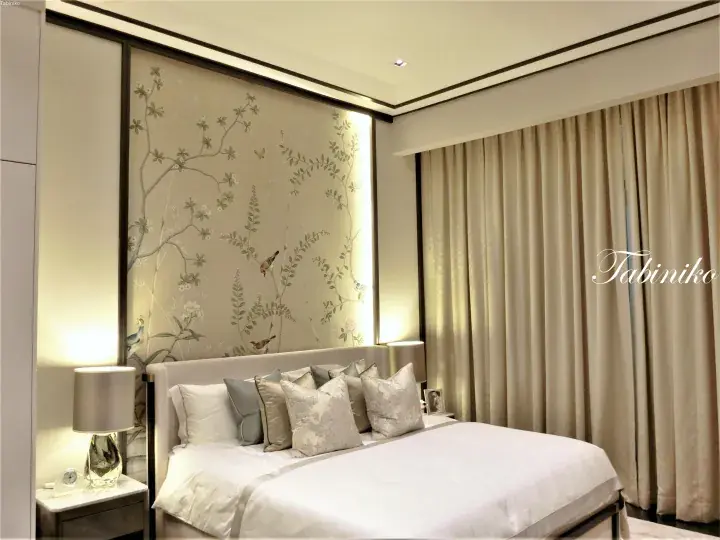 Elegant bedroom with floral wallpaper, soft lighting, and neutral-toned bedding in a luxury Malaysian property.