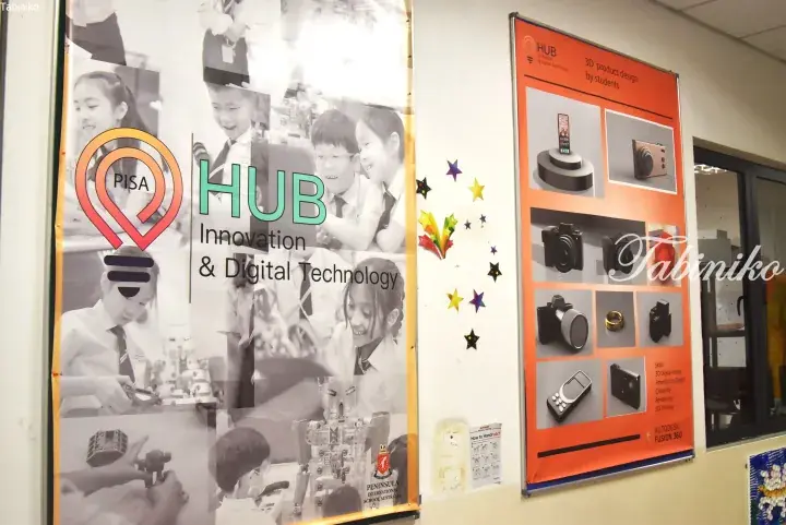 PISA HUB Innovation and Digital Technology classroom displays featuring student 3D product designs and robotics activities.
