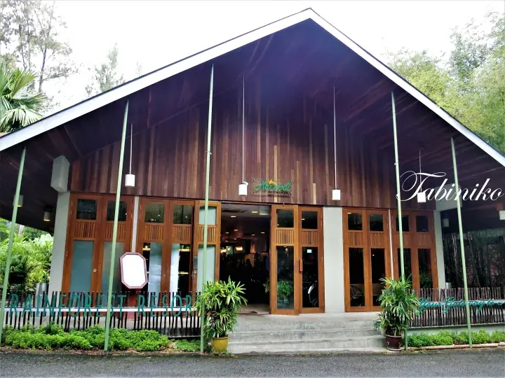 Hornbill Restaurant at Tabin Rainforest Resort, featuring wooden architecture and lush greenery.