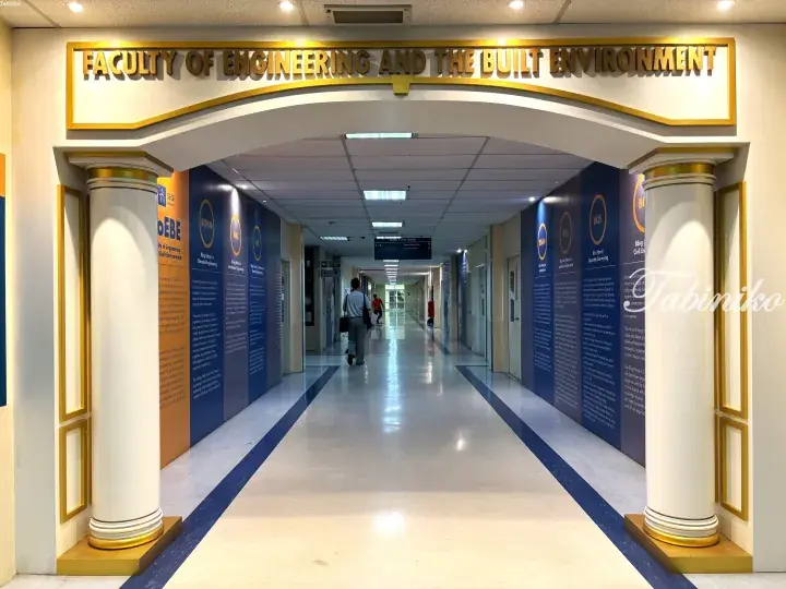 Entrance to the Faculty of Engineering and the Built Environment at SEGi University, featuring golden signage and columns.