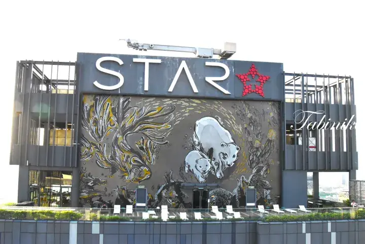 The exterior of Star Pavilion in Kuala Lumpur featuring a large mural with polar bears and fish.