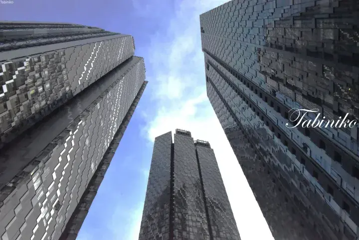 Low-angle view of modern skyscrapers with geometric facades reaching towards a blue sky.