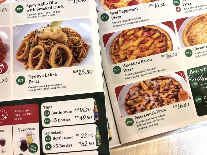 Menu featuring Nyonya Laksa Pasta, Nasi Lemak Pizza, and Tiger beer prices in Malaysian Ringgit