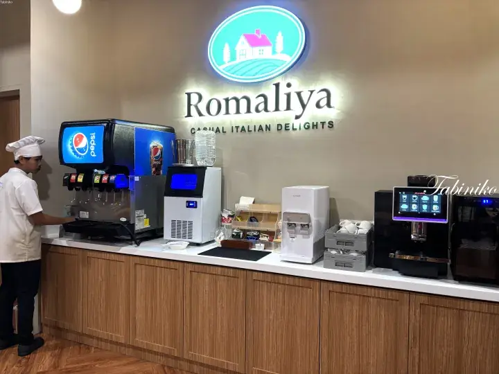 Romaliya restaurant beverage station with soda fountain, ice maker, water dispenser, and coffee machine.