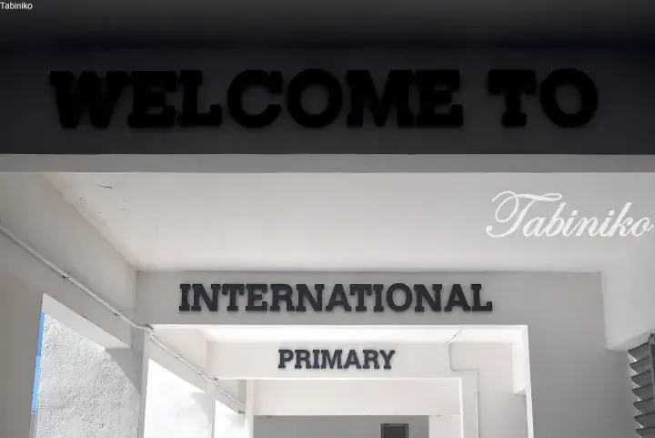 Welcome sign at the entrance of an international primary school building.