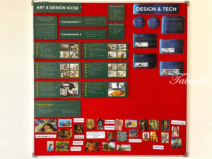 Red bulletin board displaying Art & Design IGCSE and Design & Tech curriculum details, prep durations, and student artwork examples.