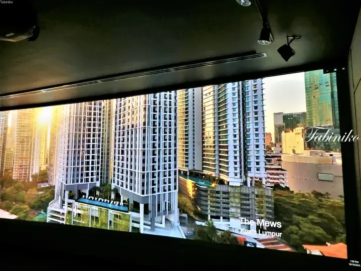 The Mews Kuala Lumpur high-rise residential building with a rooftop pool and surrounding city skyline.
