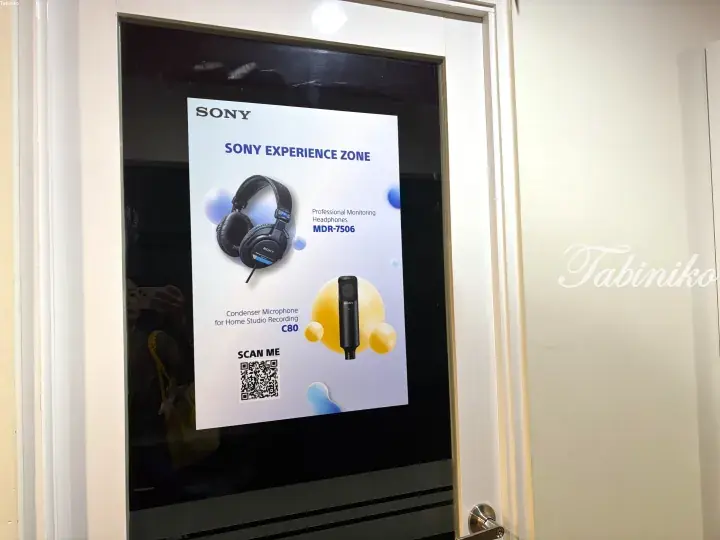 Sony Experience Zone poster advertising MDR-7506 headphones and C80 microphone with a QR code.