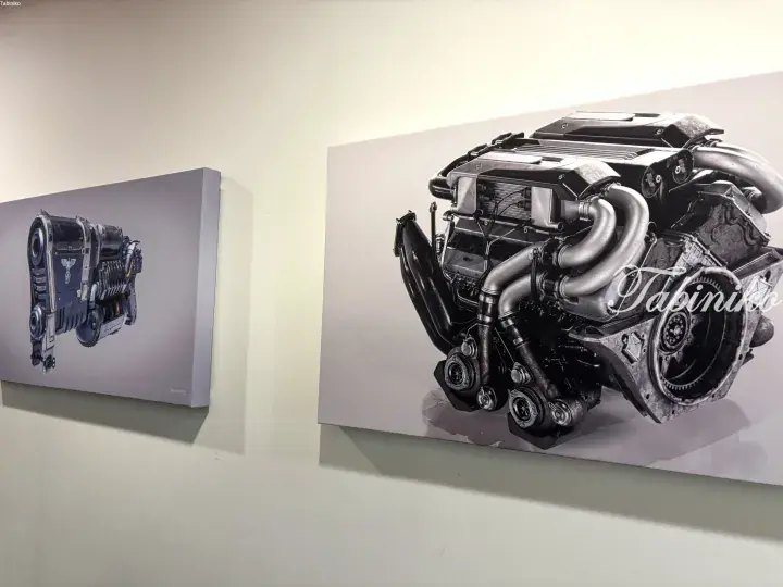 Wall-mounted artwork featuring detailed illustrations of futuristic sci-fi engine components and mechanical designs.