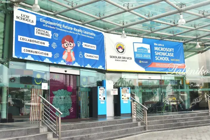 UCSI Schools Kuala Lumpur entrance with banners promoting 21st-century education and Microsoft Showcase School status.