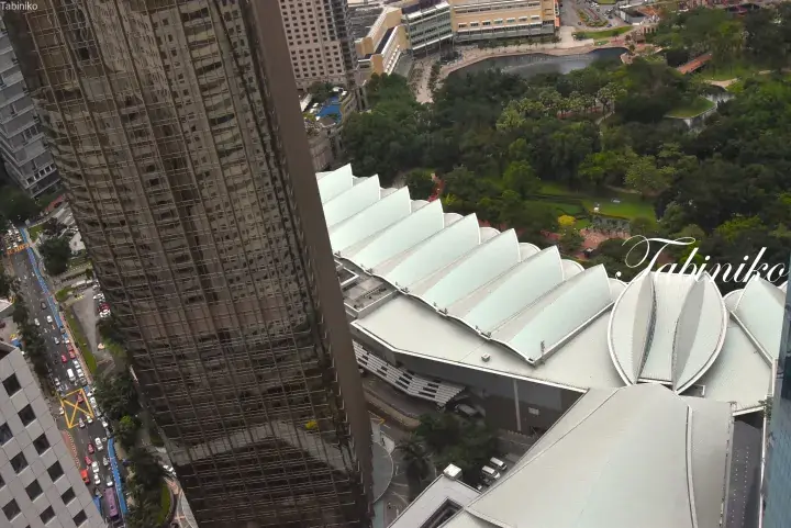 Aerial view of Kuala Lumpur’s Convention Centre and KLCC Park from a high-rise building.