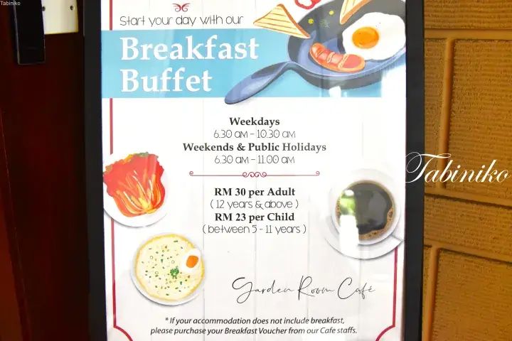 Breakfast buffet menu at Garden Room Cafe showing weekday and weekend hours plus pricing for adults and children.