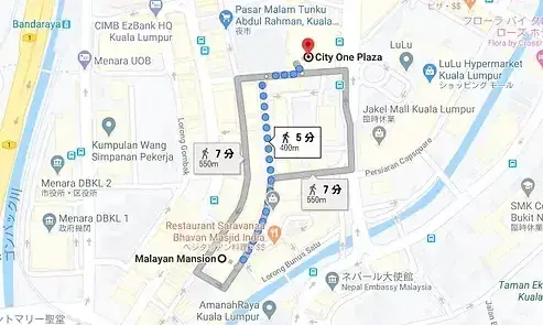 Map showing walking routes from Malayan Mansion to City One Plaza with estimated times of 5 and 7 minutes.