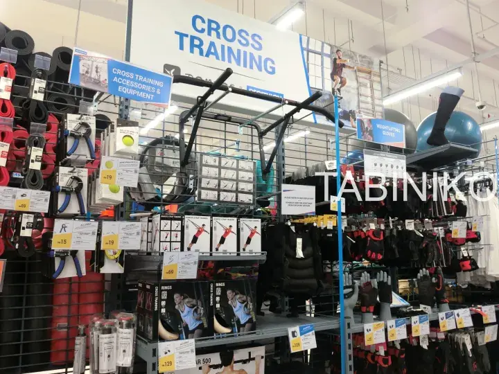 Cross training accessories and equipment display in a store with pull-up bars and resistance bands