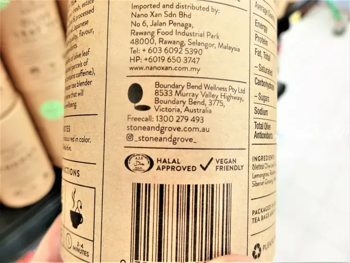 Close-up of a product label showing Nano Xan Sdn Bhd import details and Stone and Grove distributor information.