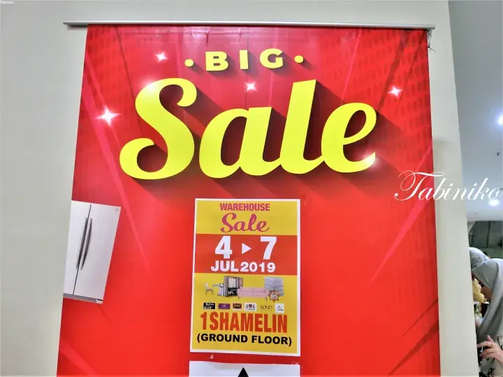 Red BIG Sale banner advertising a Warehouse Sale at 1 Shamelin Ground Floor from 4-7 July 2019.