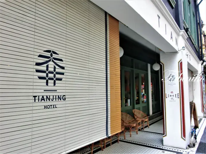 The Tianjing Hotel facade features a modern logo and white slatted wall, with a Lim Kee Cafe entrance visible to the right.