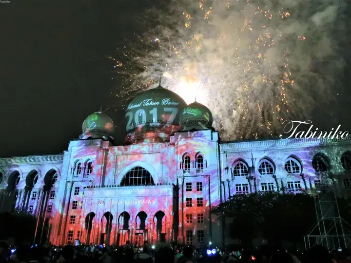 National Palace illuminated with 2017 projection and fireworks during New Year celebrations.