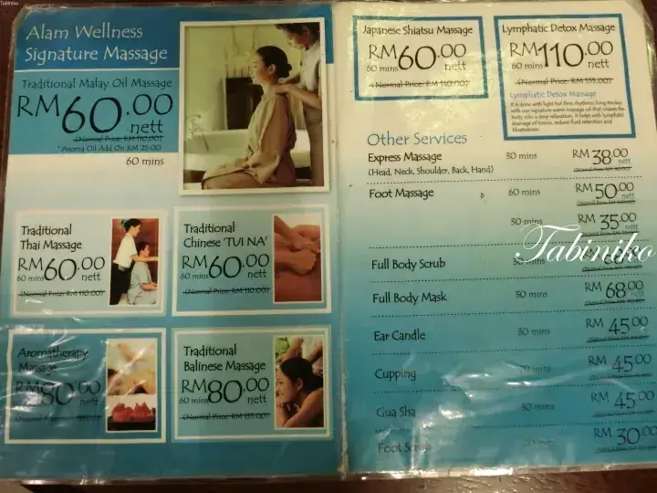 Menu displaying massage services and prices in Malaysian Ringgit, including Alam Wellness Signature Massage and Traditional Thai Massage.
