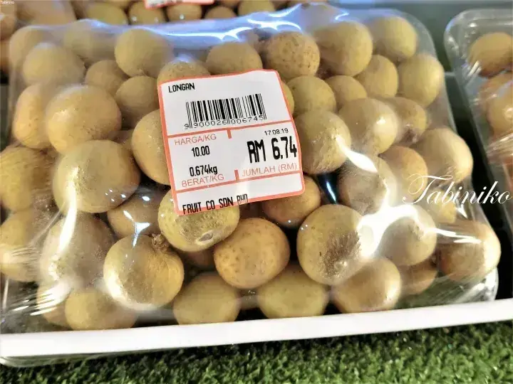 Packaged longan fruit with a price label showing RM 6.74 from Fruit Co Sdn Bhd.