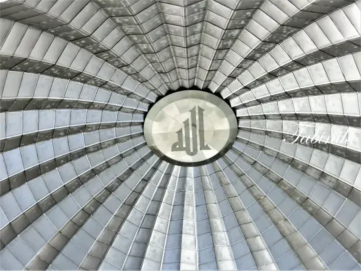 View looking up at the metallic geometric dome ceiling of Pavilion Kuala Lumpur featuring the iconic PL logo at the center.