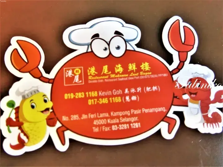 Red crab-shaped business card for Bagan Seafood View Port restaurant featuring cartoon seafood characters and contact details.