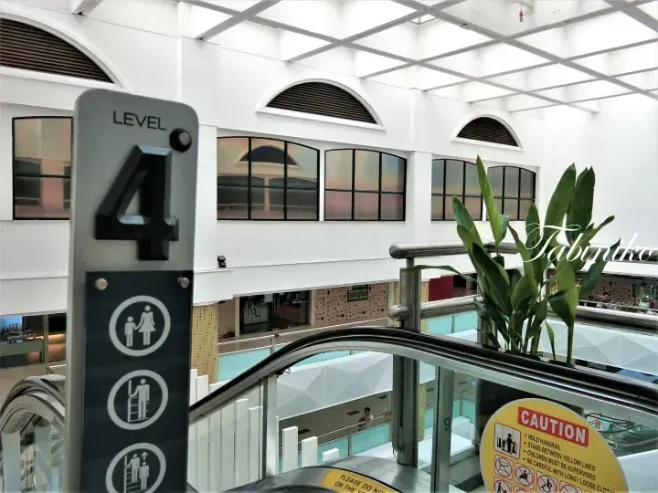 Level 4 signage at Sunway Pyramid mall with escalator and safety instructions