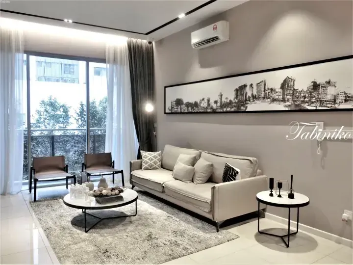 Modern living room with beige sofa, cityscape art, and balcony view at a property