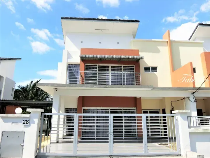 Modern two-storey terrace house with white and terracotta facade, balcony, and white metal gate under blue sky