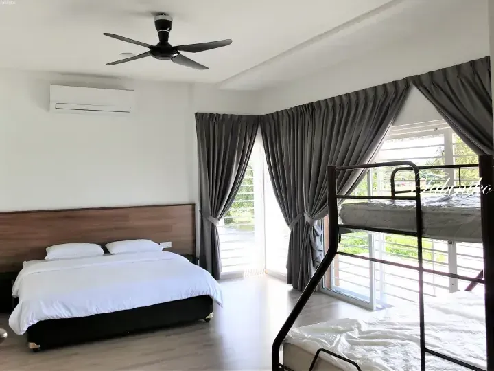 Bright bedroom with a double bed and bunk bed, featuring grey curtains and a balcony view.